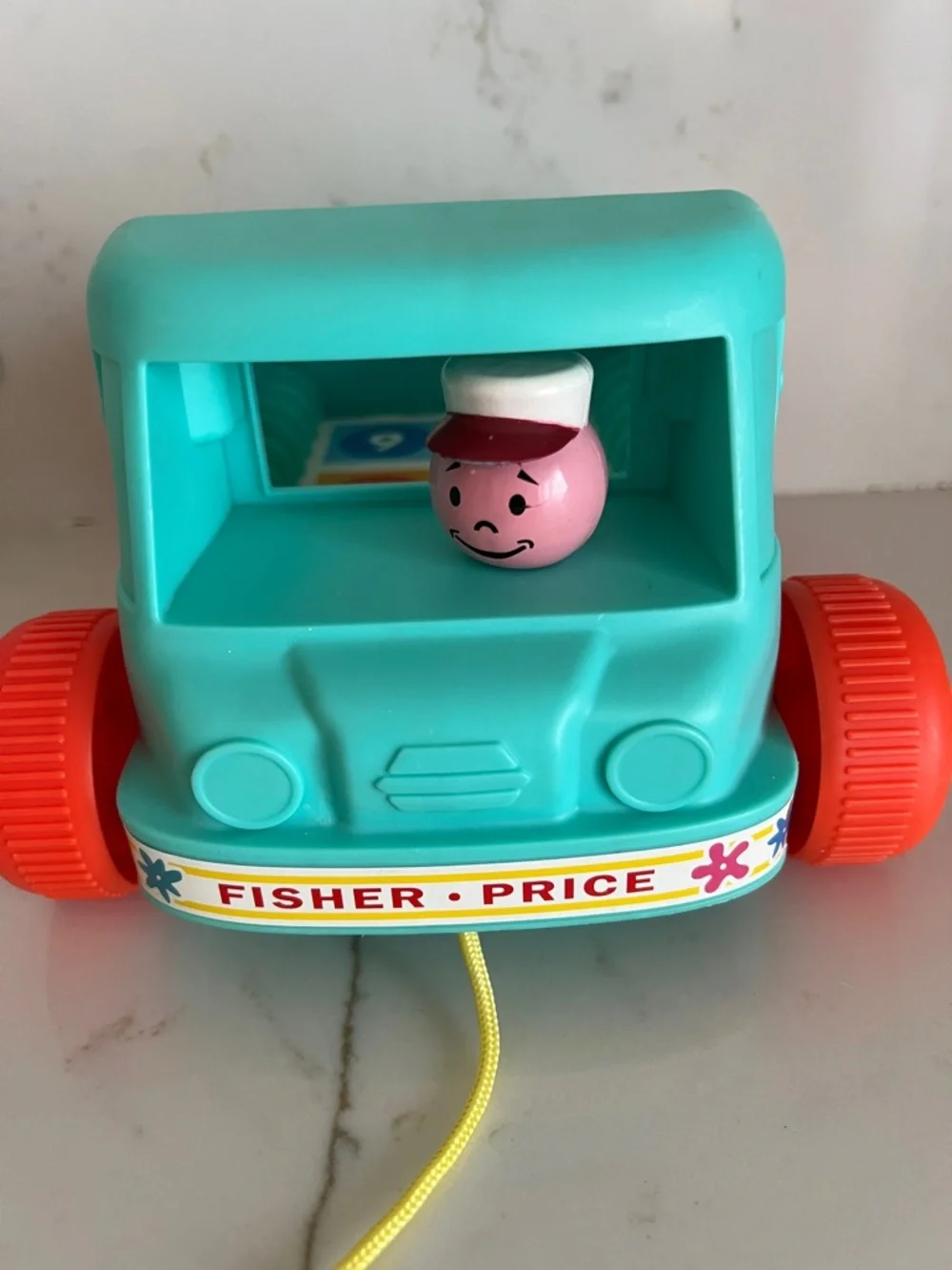 Fisher-Price Teal Milk Wagon Pull Toy with Bright Orange Wheels